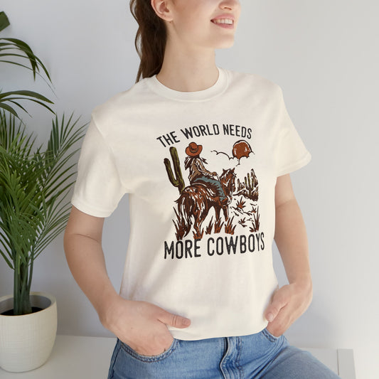 The World Needs More Cowboys Tee - Printify- Desert Darling Brand
